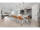 Open-concept kitchen with a large island, stylish bar stools, and stainless steel appliances, great for entertaining at 737 Hyperion Dr, Debary, FL 32713