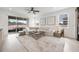 Bright living room with large windows and sliding glass doors to an outdoor patio at 737 Hyperion Dr, Debary, FL 32713