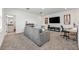 Upstairs living room features carpet, a TV, and a small workstation with natural light at 737 Hyperion Dr, Debary, FL 32713