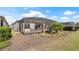 A spacious screened-in lanai and patio extends from this house into a beautifully landscaped yard at 7928 Hanson Bay Pl, Kissimmee, FL 34747