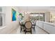 Stylish dining area featuring modern decor, a view to the lanai, and comfortable seating at 7928 Hanson Bay Pl, Kissimmee, FL 34747