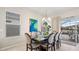 The bright dining room is adjacent to the lanai and has seating for eight as well as natural light at 7928 Hanson Bay Pl, Kissimmee, FL 34747