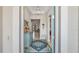 Inviting entryway showcasing a stylish rug, console table, and a view into the home's open layout at 7928 Hanson Bay Pl, Kissimmee, FL 34747