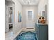 Inviting entryway with a colorful rug and console table, leads to the living spaces at 7928 Hanson Bay Pl, Kissimmee, FL 34747