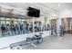 Modern gym with weight machines, free weights, and a mirrored wall at 7928 Hanson Bay Pl, Kissimmee, FL 34747