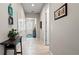 Hallway featuring neutral walls, tile flooring, and views into other rooms of the home at 7928 Hanson Bay Pl, Kissimmee, FL 34747