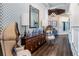 Hallway featuring beautiful wood floors, designer wall paper, coffered ceiling and ornate wood accents at 7928 Hanson Bay Pl, Kissimmee, FL 34747