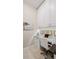 Bright home office featuring white cabinetry, desk space, and a tranquil beach view decal at 7928 Hanson Bay Pl, Kissimmee, FL 34747
