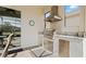 A built-in stainless steel grill and granite countertop make this a great outdoor kitchen at 7928 Hanson Bay Pl, Kissimmee, FL 34747