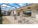 Screened-in lanai with an outdoor seating area at 7928 Hanson Bay Pl, Kissimmee, FL 34747