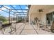 Spacious covered patio with dining set and seating area at 7928 Hanson Bay Pl, Kissimmee, FL 34747