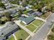 Overhead shot of the home and surrounding neighborhood featuring mature landscaping, with backyard pool and ample street parking at 812 Arlington Blvd, Altamonte Springs, FL 32701