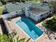 A captivating aerial shot highlighting the inviting backyard pool with lush landscaping in this meticulously maintained home at 812 Arlington Blvd, Altamonte Springs, FL 32701