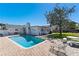 Spacious backyard featuring a private pool, a brick-paved patio, mature tree, and privacy fence at 812 Arlington Blvd, Altamonte Springs, FL 32701