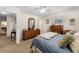 Cozy bedroom featuring a plush bed, wooden dresser, and serene atmosphere at 812 Arlington Blvd, Altamonte Springs, FL 32701