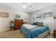 Inviting bedroom with a plush bed, neutral walls, dresser, and a bright window at 812 Arlington Blvd, Altamonte Springs, FL 32701
