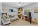 Sunlit bedroom featuring neutral walls, carpet, bright window, and quaint wooden desk at 812 Arlington Blvd, Altamonte Springs, FL 32701