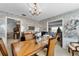 Vintage dining room featuring a wood table, chandelier, and access to other rooms, offering a glimpse of the home's layout at 812 Arlington Blvd, Altamonte Springs, FL 32701