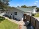 The exterior of this home showcases a well-maintained lawn, a charming brick walkway, and access to a serene backyard oasis at 812 Arlington Blvd, Altamonte Springs, FL 32701