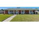 Single-story home featuring a brick facade, white columns, and a well-manicured lawn at 812 Arlington Blvd, Altamonte Springs, FL 32701