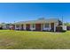 A charming single-story home featuring a brick facade, white columns, and a well-manicured lawn at 812 Arlington Blvd, Altamonte Springs, FL 32701