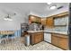 Kitchen with white appliances, a dining area, and tile flooring at 812 Arlington Blvd, Altamonte Springs, FL 32701