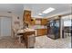 Kitchen features tile floor, breakfast bar, and black appliances at 812 Arlington Blvd, Altamonte Springs, FL 32701