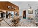 Kitchen featuring tile countertops, breakfast bar, and adjacent dining area at 812 Arlington Blvd, Altamonte Springs, FL 32701