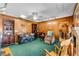 Vintage-style living room with wood paneling, comfortable seating, and access to other rooms, offering a cozy retreat at 812 Arlington Blvd, Altamonte Springs, FL 32701