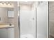 Bathroom featuring a shower with a glass door and wire rack shelving at 911 N Orange Ave # 447, Orlando, FL 32801