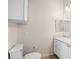 Bathroom featuring a toilet, vanity, and mirror with overhead lighting at 911 N Orange Ave # 447, Orlando, FL 32801