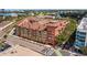 A beautiful view of a modern apartment building with street access and train tracks nearby at 911 N Orange Ave # 447, Orlando, FL 32801