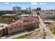 A modern apartment complex in an urban setting near train tracks and downtown buildings at 911 N Orange Ave # 447, Orlando, FL 32801