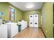 Clean laundry room equipped with multiple washers, dryers, and ample space at 911 N Orange Ave # 447, Orlando, FL 32801