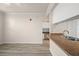 A cozy living room with a breakfast bar and partial kitchen view, creating an open-concept living space at 911 N Orange Ave # 447, Orlando, FL 32801
