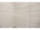 White metal shelving system in a walk-in closet for storage at 911 N Orange Ave # 447, Orlando, FL 32801