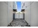 Narrow enclosed outdoor space with pavers and white privacy fence at 927 City Walk Ln, Oviedo, FL 32765