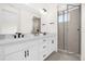 Modern bathroom featuring double sink vanity and glass-enclosed shower at 927 City Walk Ln, Oviedo, FL 32765