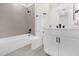 Modern bathroom with neutral tile, white fixtures, and a clean design at 927 City Walk Ln, Oviedo, FL 32765