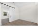 Bedroom with a sliding barn door and wood-look flooring at 927 City Walk Ln, Oviedo, FL 32765