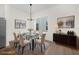 Bright dining room features modern chandelier, glass table, and neutral tones at 927 City Walk Ln, Oviedo, FL 32765
