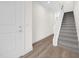 Bright entryway with staircase and wood-look flooring at 927 City Walk Ln, Oviedo, FL 32765