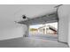 A large garage with an open door reveals an exterior view of the neighborhood at 927 City Walk Ln, Oviedo, FL 32765