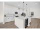 Modern kitchen with island and wine cooler at 927 City Walk Ln, Oviedo, FL 32765