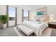Bright main bedroom with two windows, neutral tones, and comfortable furnishings at 927 City Walk Ln, Oviedo, FL 32765