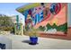 Colorful outdoor mural depicting local themes and greetings from Oviedo at 927 City Walk Ln, Oviedo, FL 32765