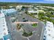 Ample parking lot for retail, garage apartment, and visitors is well-lit and beautifully landscaped at 927 City Walk Ln, Oviedo, FL 32765