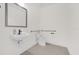 Well-appointed ADA-compliant restroom featuring a modern sink, toilet, and grab bars at 927 City Walk Ln, Oviedo, FL 32765
