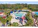 Aerial view of community water park featuring slides, splash pads, and lounge seating at 927 City Walk Ln, Oviedo, FL 32765