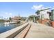 Scenic waterfront view with swan boats, restaurants, and lakeside promenade at 927 City Walk Ln, Oviedo, FL 32765